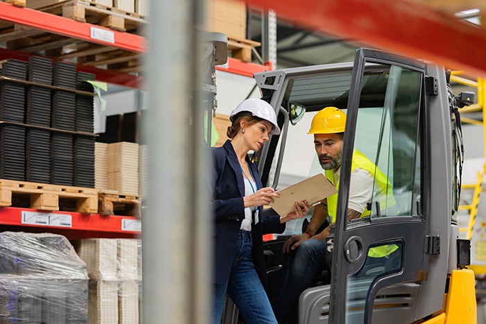Forklift,Driver,Talking,With,Manager,In,Modern,Industrial,Factory.,Warehouseman